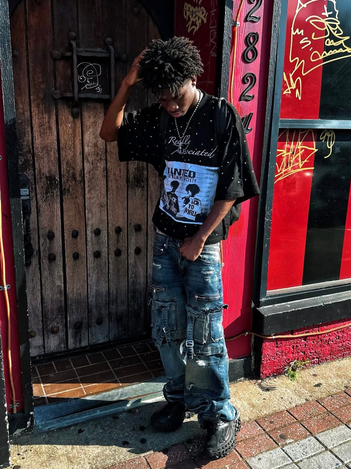 “WANTED FOR GOING AGAINST SOCIETY” TEE